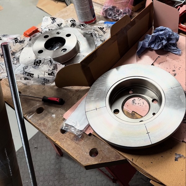 Marked up brake discs, ready for drilling